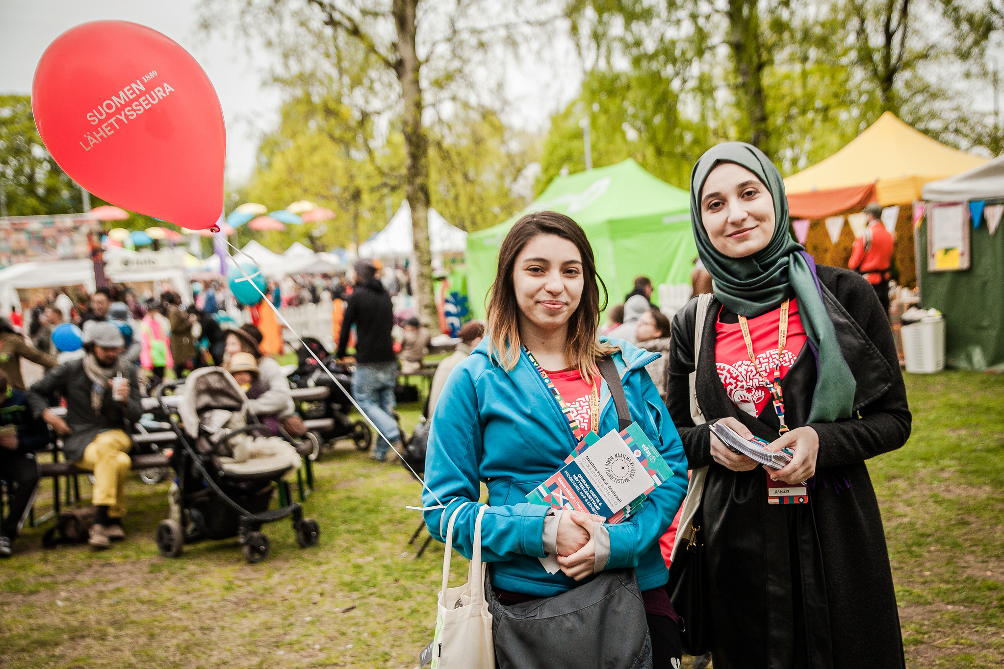 Picture of two volunteers at the festival area.