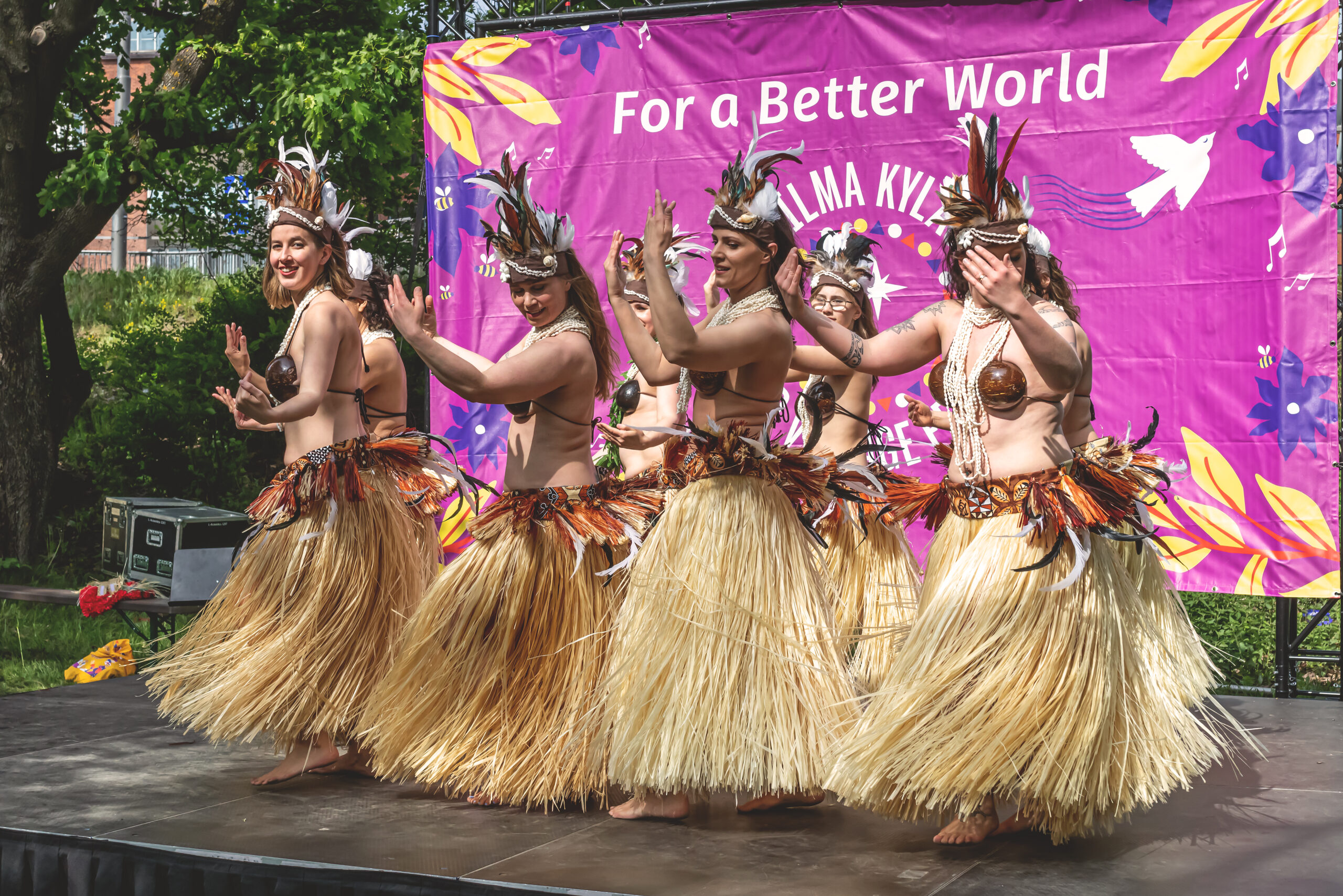 Dancers in Pacific area costumes on stage in the 2023 festival.
